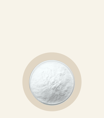 L-Tyrosine Oh La La powder in a round container on a soft beige background. High-quality supplement for wellness.